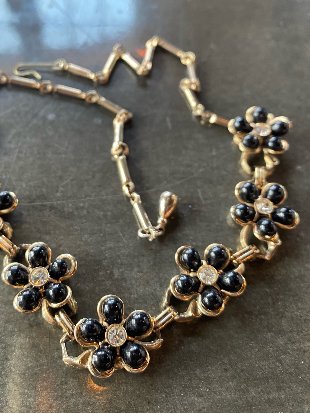 Vintage black enamel and rhinestone flowers on gold tone mid-century necklace